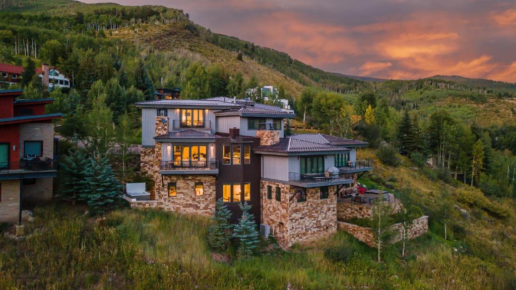 a large house on a hill in the mountains at Radiance Retreat in Vail