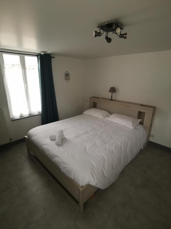 Tempat tidur dalam kamar di Mon Petit Café