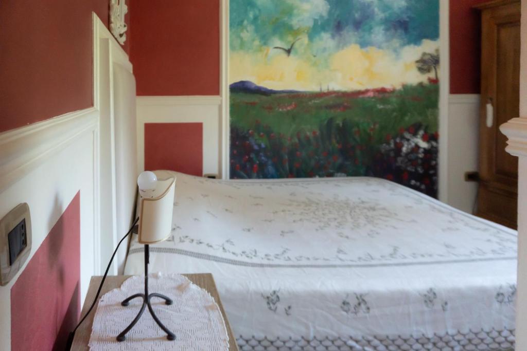 Ένα ή περισσότερα κρεβάτια σε δωμάτιο στο Aura Toscana Boutique