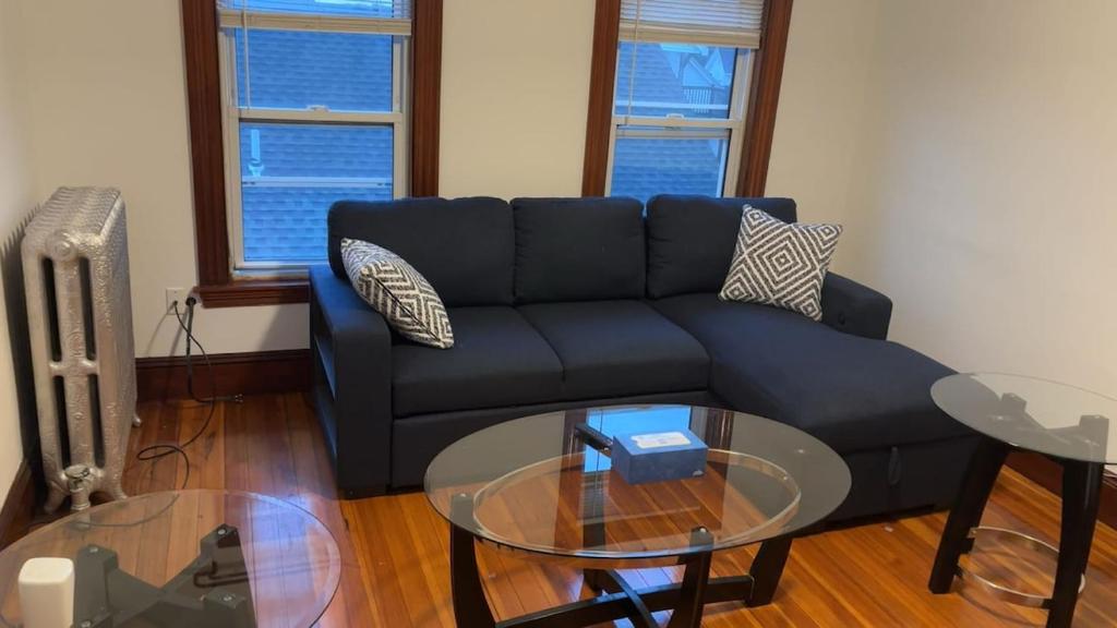 a living room with a couch and a glass table at My Kingdom in Everett
