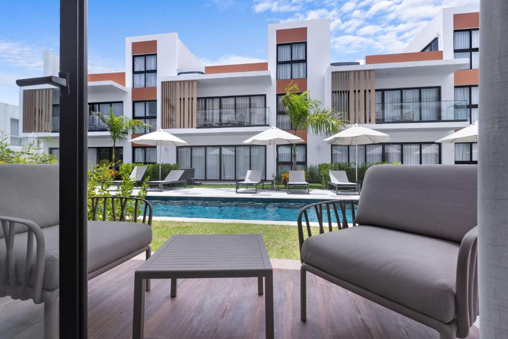 a view of a building from the patio of a resort at NOK Perfect 1 BR by Vistacana Rentals in Punta Cana