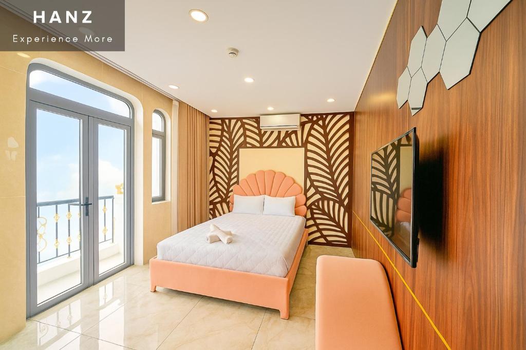 a bedroom with a bed and a large window at S79 Hotel T68 in Ho Chi Minh City