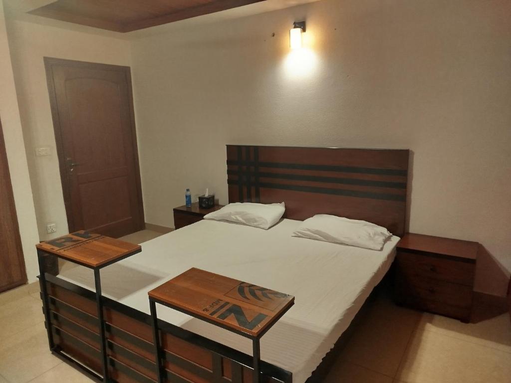 Postel nebo postele na pokoji v ubytování The Warmer Apartment Islamabad