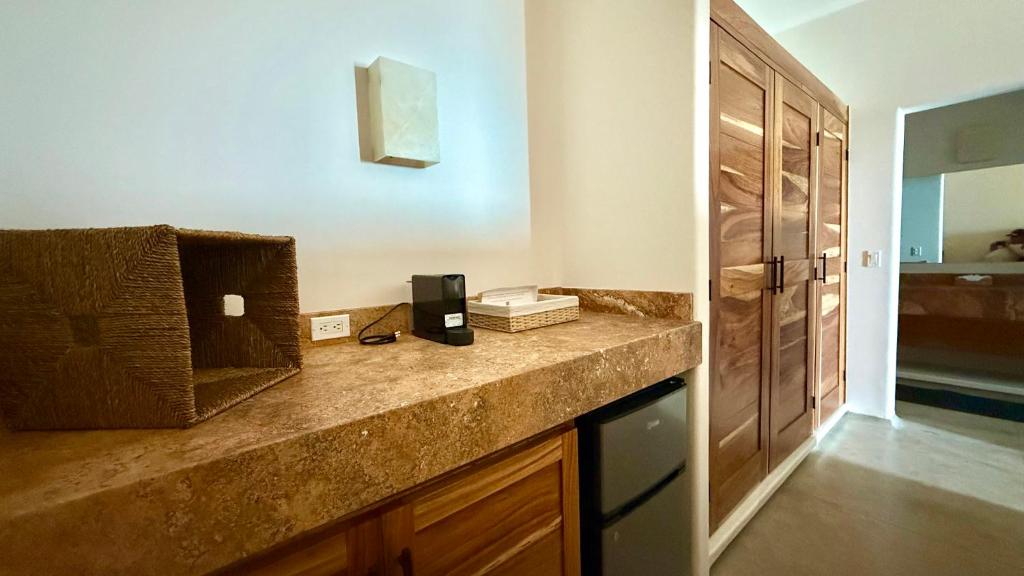a kitchen with a counter with a phone on it at Azul Beach Kite Resort in El Sargento