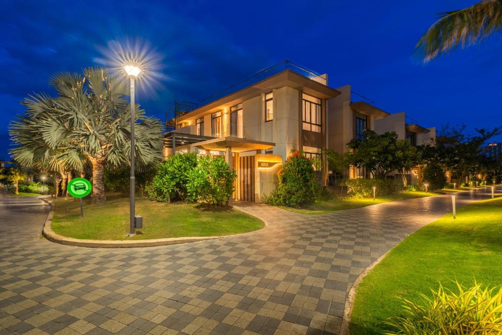 a house with a street light in front of it at Blue Sea villa in Cam Lâm