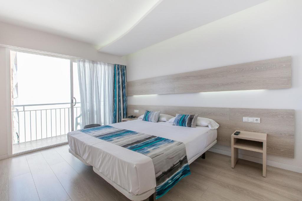 Postel nebo postele na pokoji v ubytování Hotel Gracia