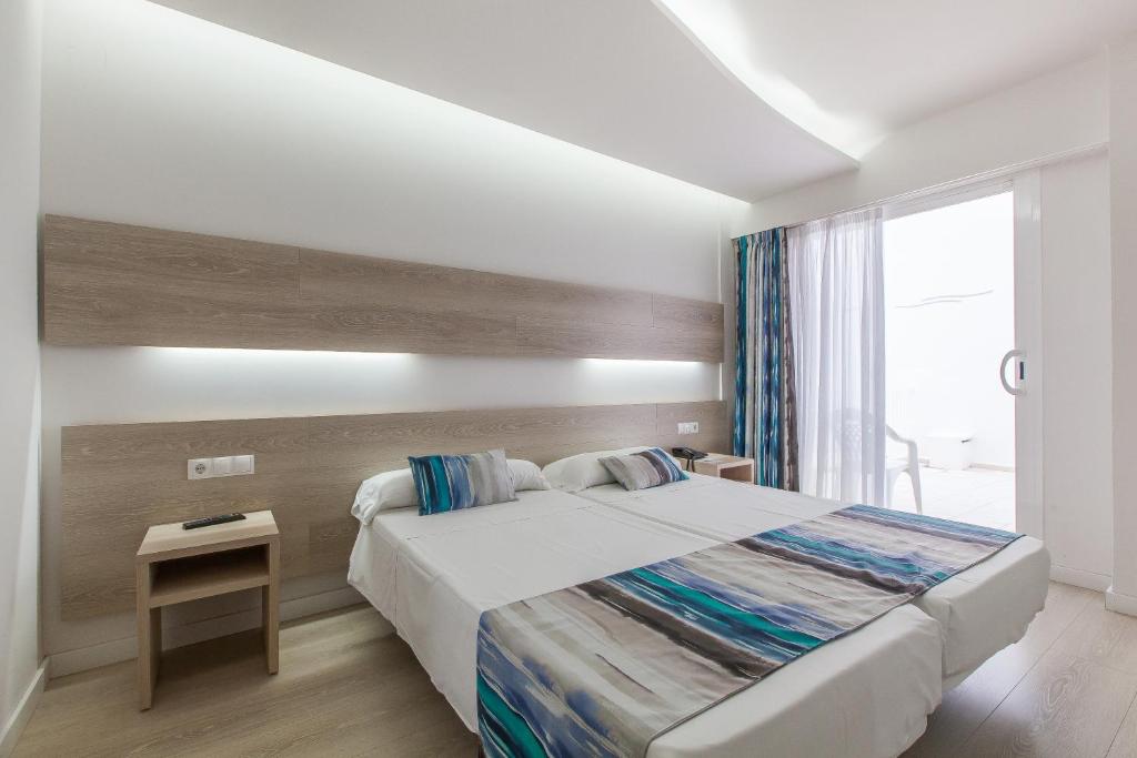Postel nebo postele na pokoji v ubytování Hotel Gracia