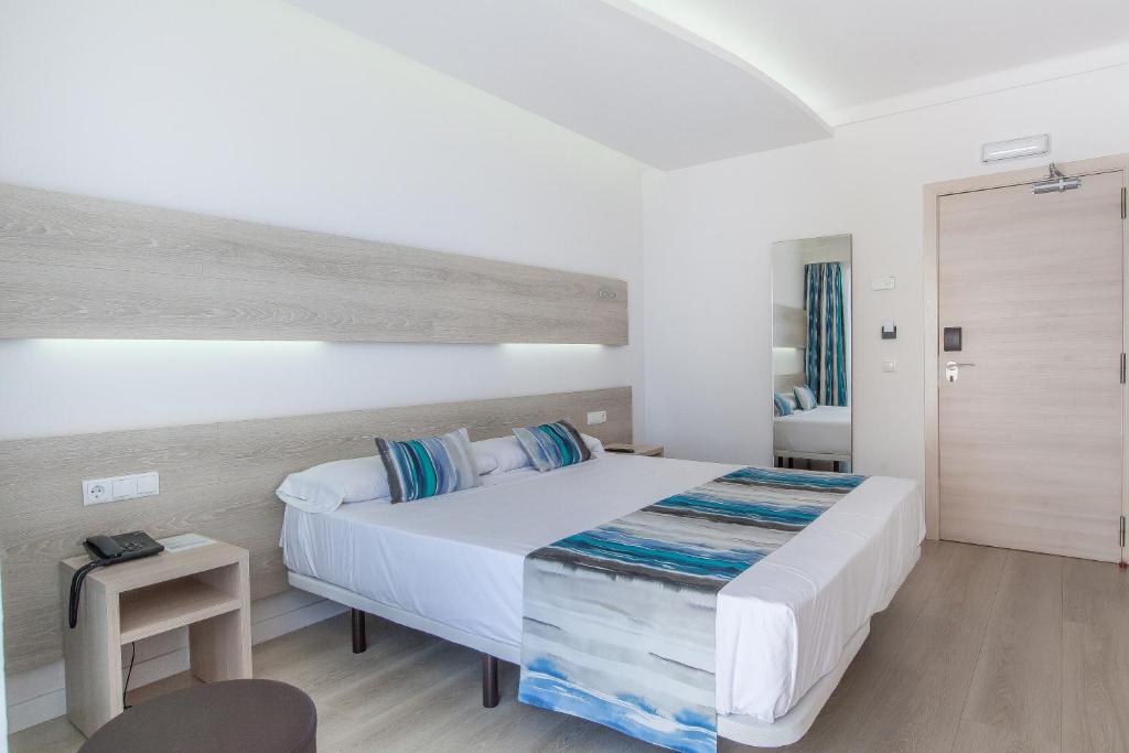 Postel nebo postele na pokoji v ubytování Hotel Gracia