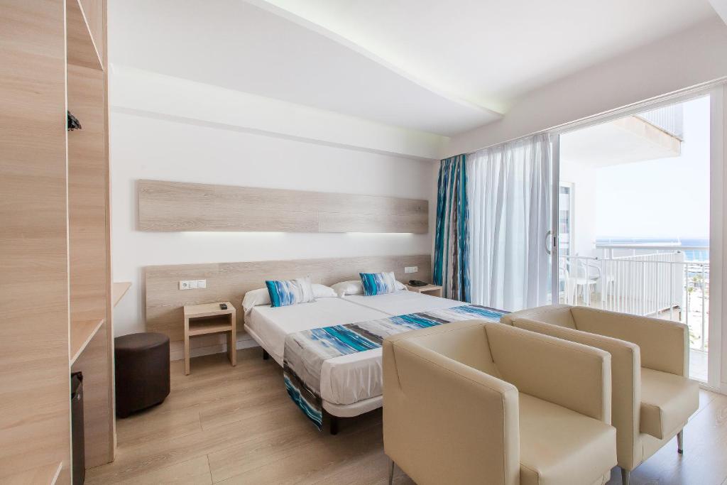 Postel nebo postele na pokoji v ubytování Hotel Gracia