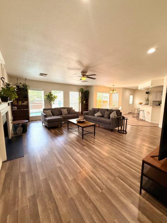 a large living room with couches and a fireplace at Minutes from Sea World and Fiesta Texas in San Antonio