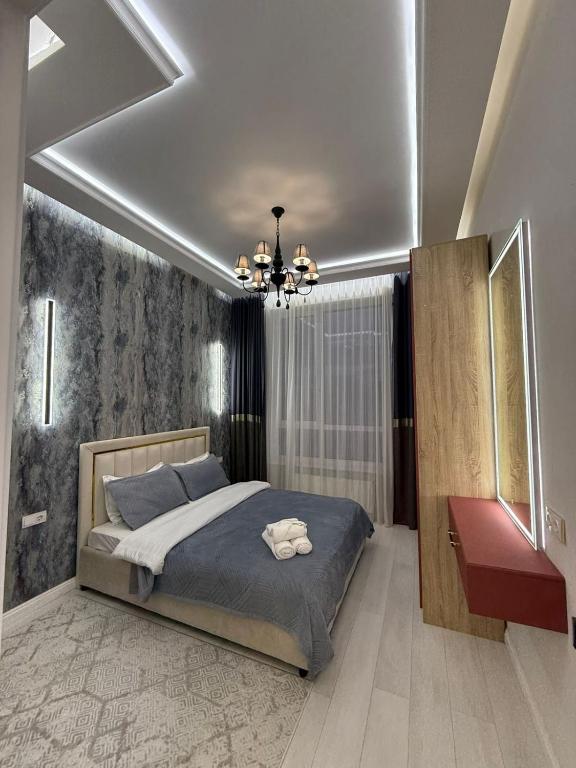 Postel nebo postele na pokoji v ubytování Luxury apartments in Astana