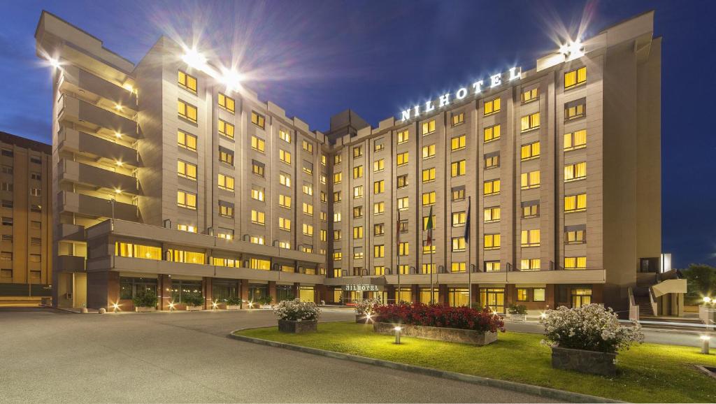 a large building with lights on top of it at NilHotel Florence in Florence