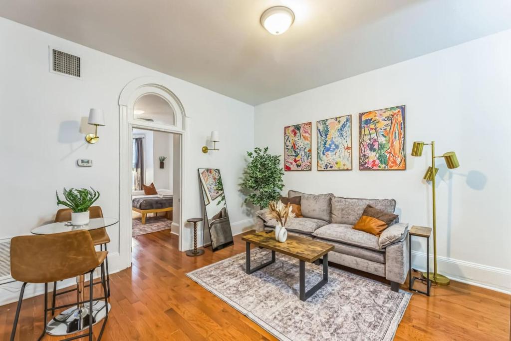 a living room with a couch and a table at Charming 1BR in Center City that Sleeps 4 with Fast WiFi in Philadelphia