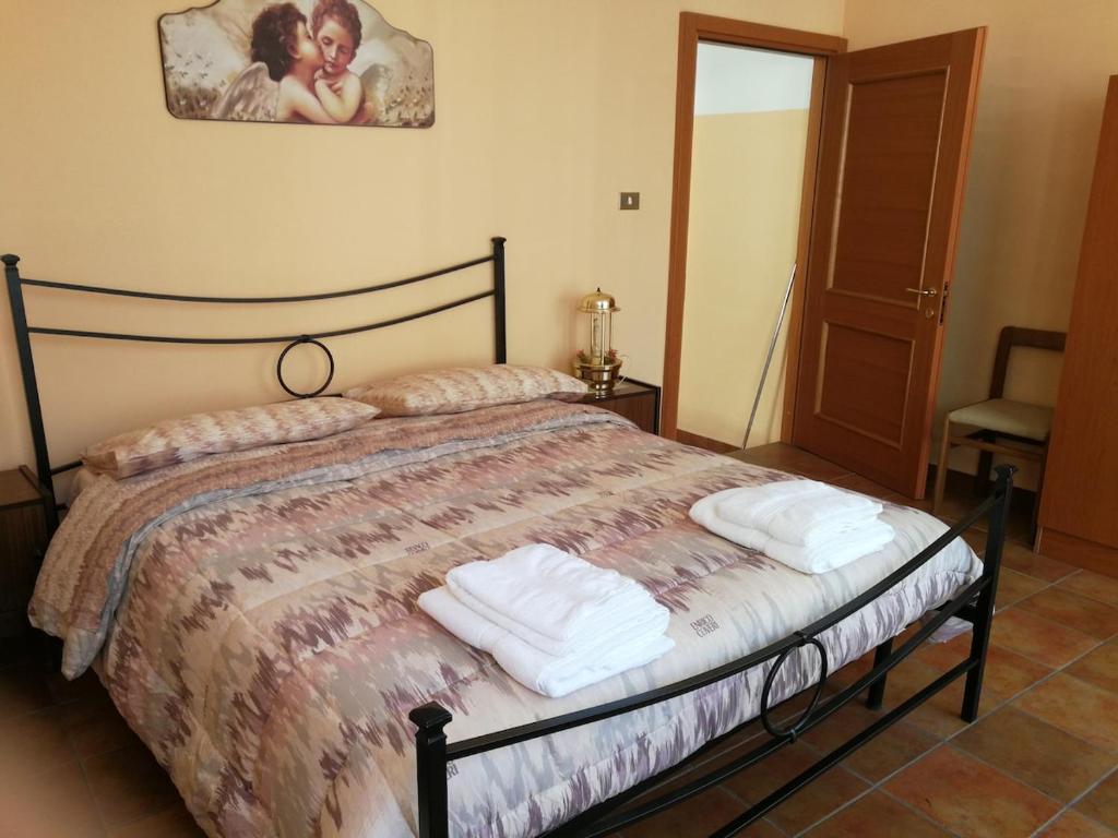 Кровать или кровати в номере Soggiorno a Fara San Martino da Raffaella