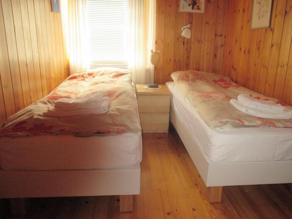 Postel nebo postele na pokoji v ubytování Grímsstaðir Guesthouse