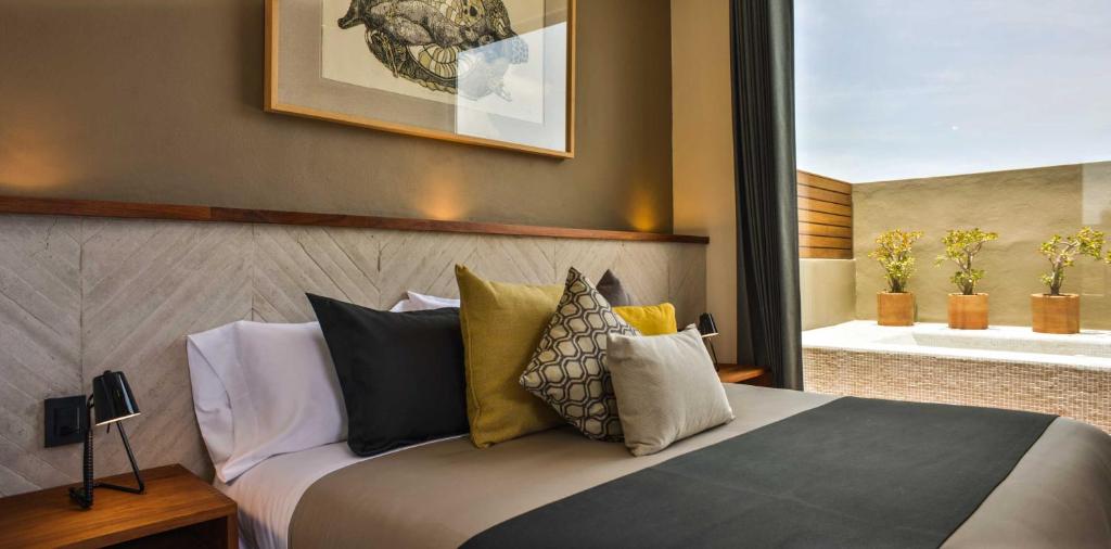 Postel nebo postele na pokoji v ubytování Hotel Criol