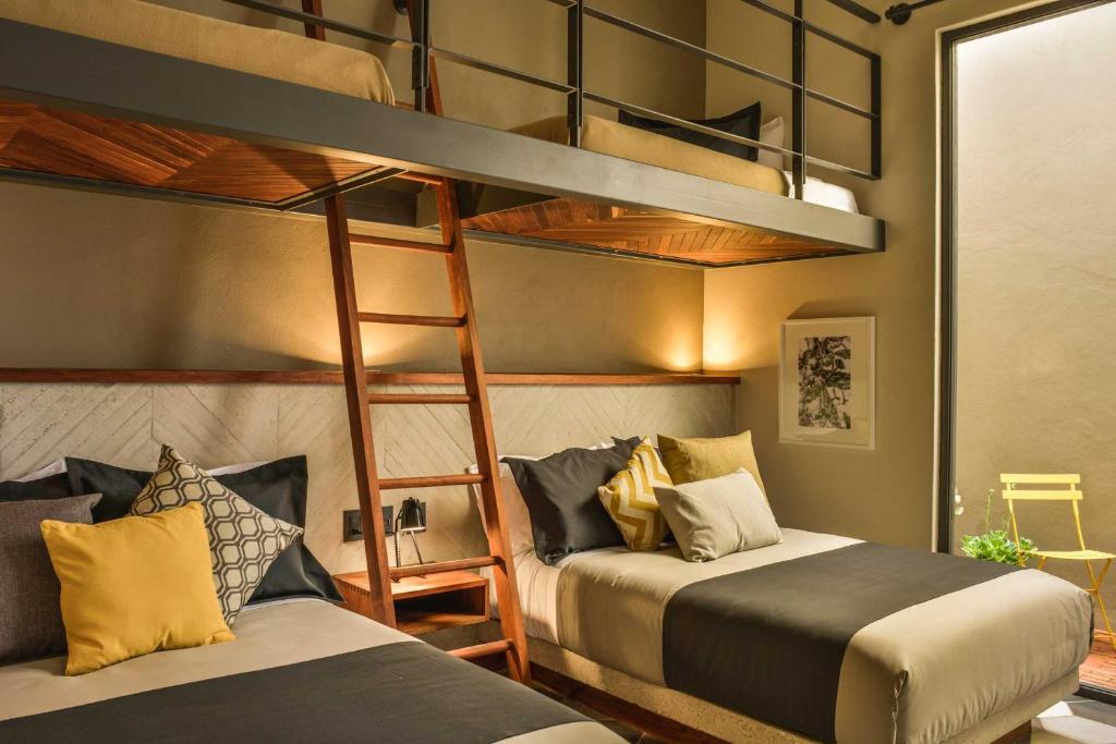Postel nebo postele na pokoji v ubytování Hotel Criol