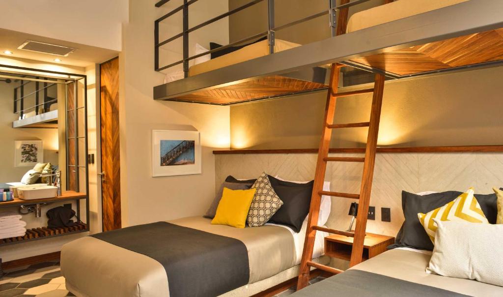 Postel nebo postele na pokoji v ubytování Hotel Criol