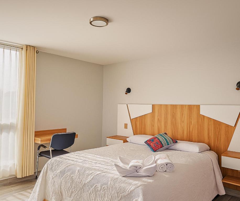 Postel nebo postele na pokoji v ubytování Hotel Florez Boutique