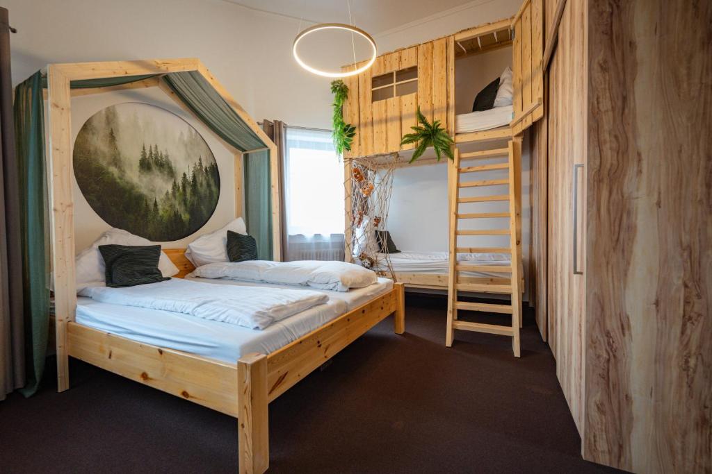 a bedroom with two bunk beds and a ladder at Wald Villa Schönau in Schönau an der Brend