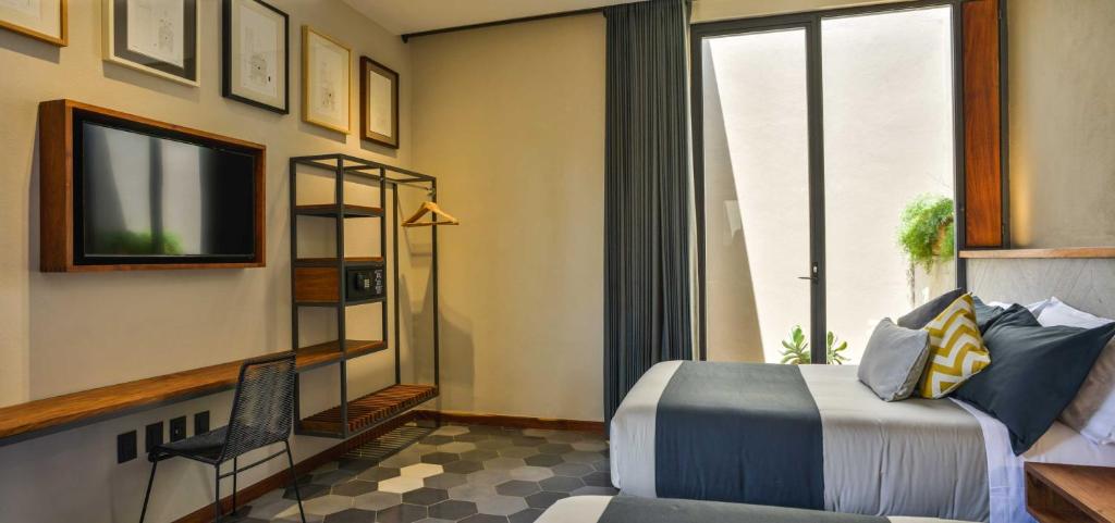 TV a/nebo společenská místnost v ubytování Hotel Criol
