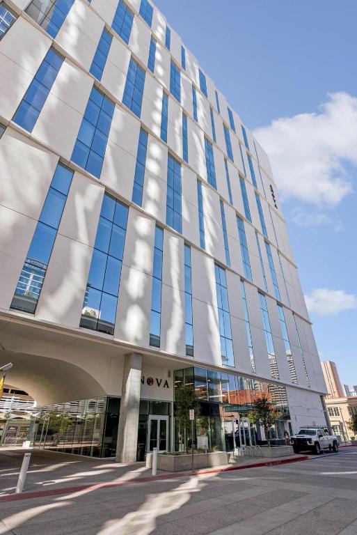 a building with a lot of windows on a street at Placemakr Downtown Phoenix in Phoenix