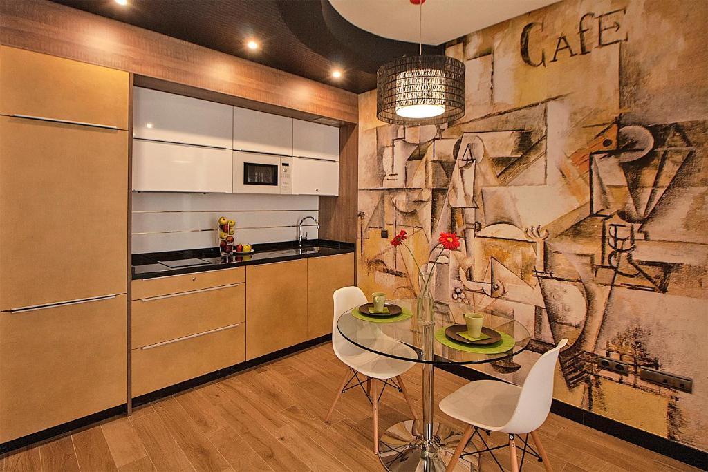 Kuchyňa alebo kuchynka v ubytovaní Apartamentos Suites Oficentro Deluxe