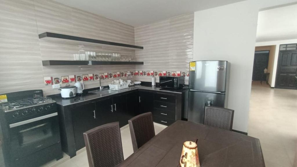 Kuchyň nebo kuchyňský kout v ubytování Edificio Lirae