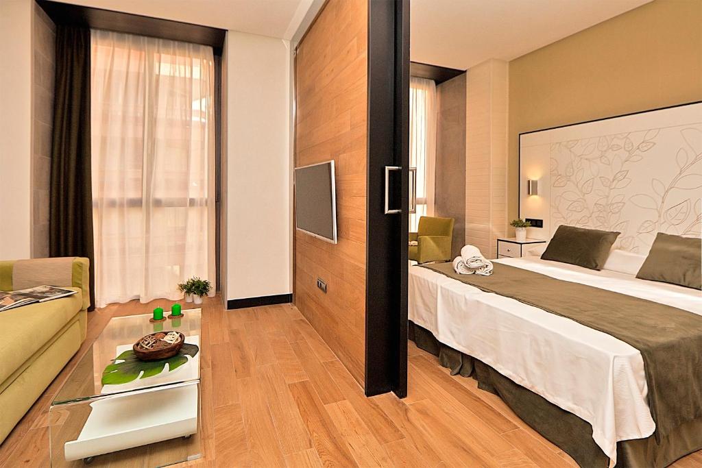Posteľ alebo postele v izbe v ubytovaní Apartamentos Suites Oficentro Deluxe