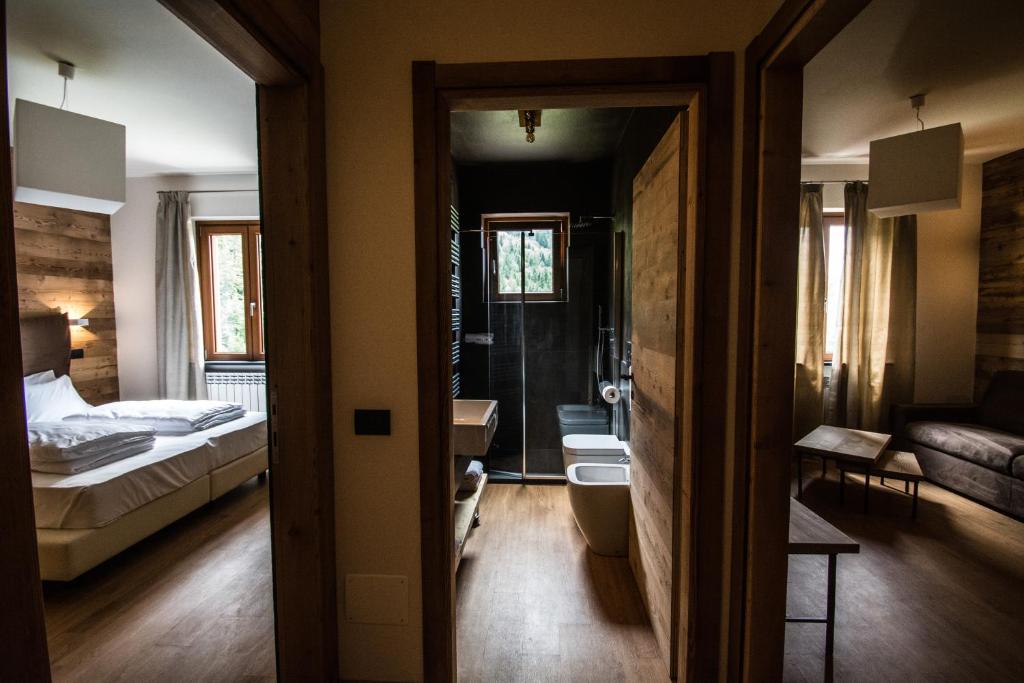 Postel nebo postele na pokoji v ubytování Orobie Alps Resort