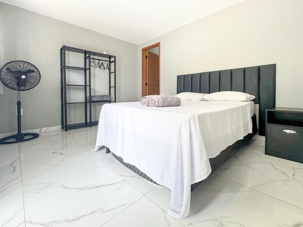 Ένα ή περισσότερα κρεβάτια σε δωμάτιο στο Pousada Praia Grande de Palmas