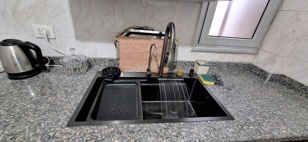 Η κουζίνα ή μικρή κουζίνα στο Jannat Madinaty