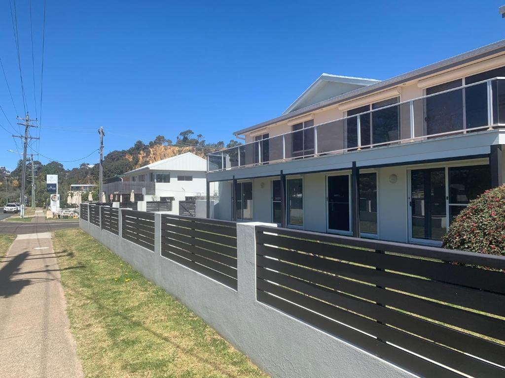 a fence on the side of a building at Noble House in Tathra