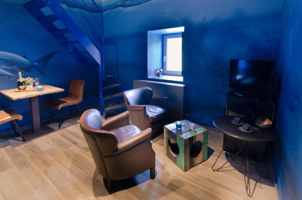 Posezení v ubytování River Lodge Hotel Insolite