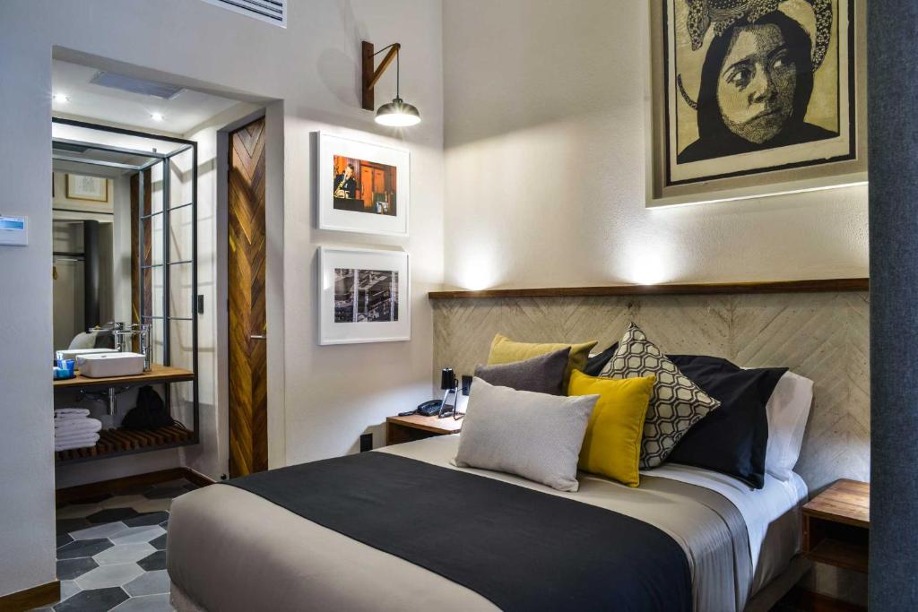 Postel nebo postele na pokoji v ubytování Hotel Criol