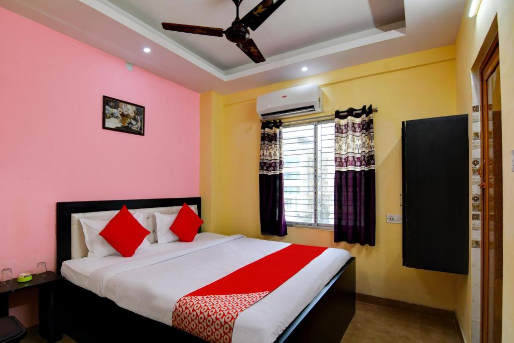 Ένα ή περισσότερα κρεβάτια σε δωμάτιο στο Super Hotel O Ashiyana Guest House