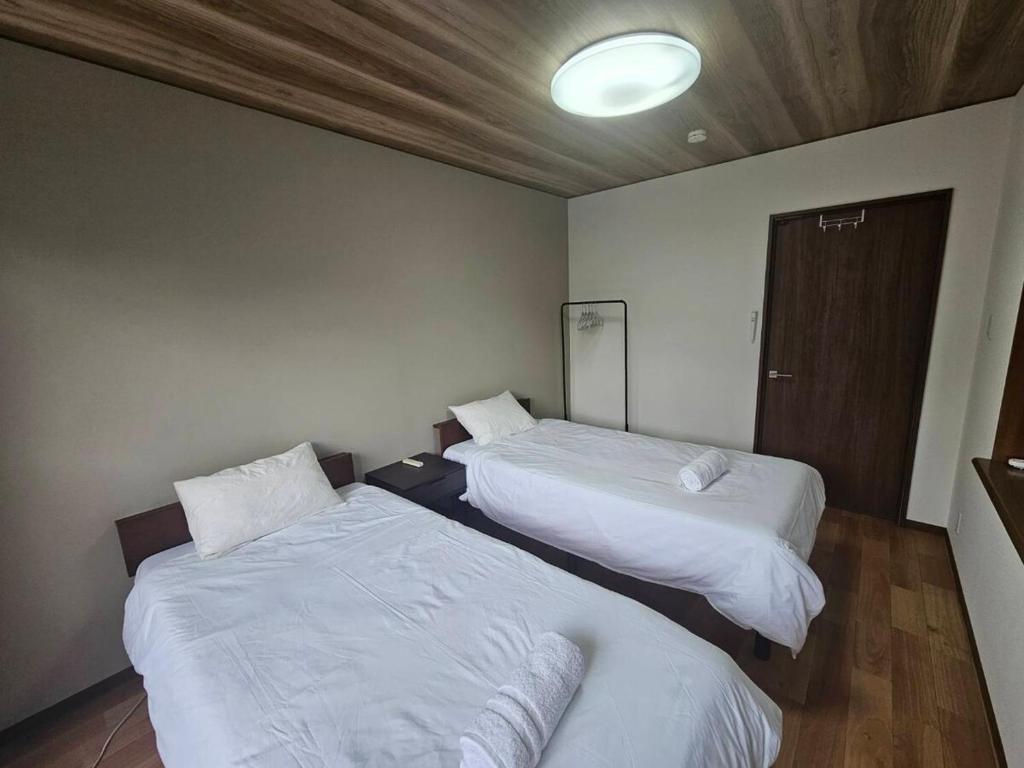 Cama o camas de una habitación en 勝清居