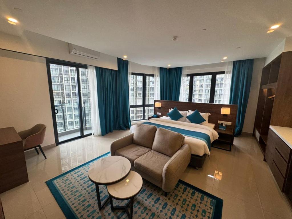 Giường trong phòng chung tại Haywood Hilltop Wellness Living Genting Highlands by 1001 Nights Hotel