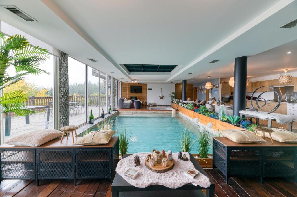 a pool in the middle of a house at Vacances de rêves - Olympique in Chamrousse