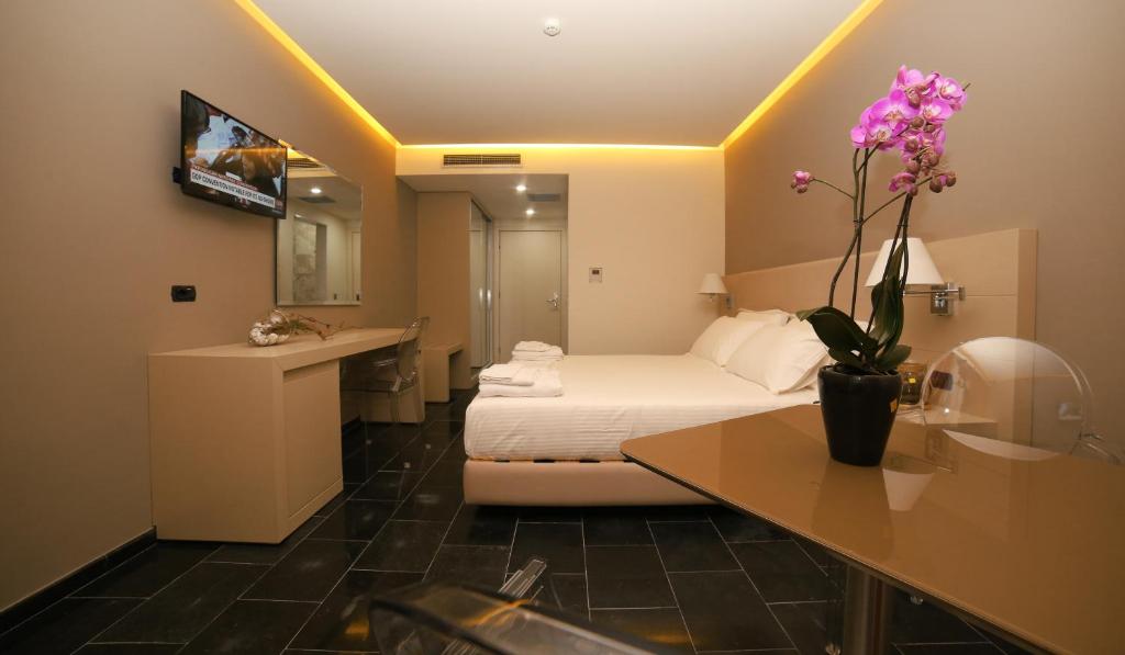 Postel nebo postele na pokoji v ubytování Hotel Palace