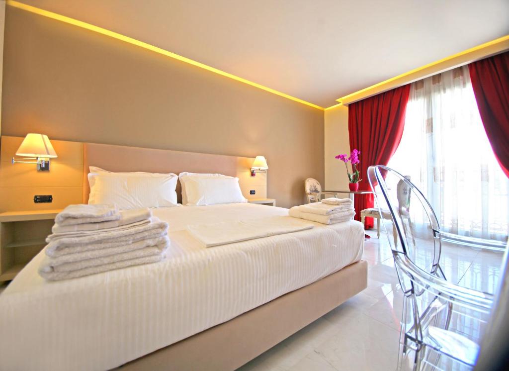 Postel nebo postele na pokoji v ubytování Hotel Palace