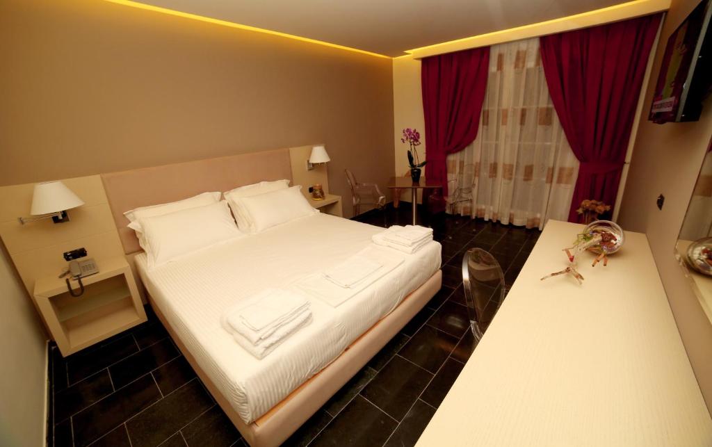 Postel nebo postele na pokoji v ubytování Hotel Palace
