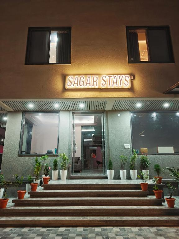 a building with a sign that reads saar stays at Sagar Stays in Jaipur