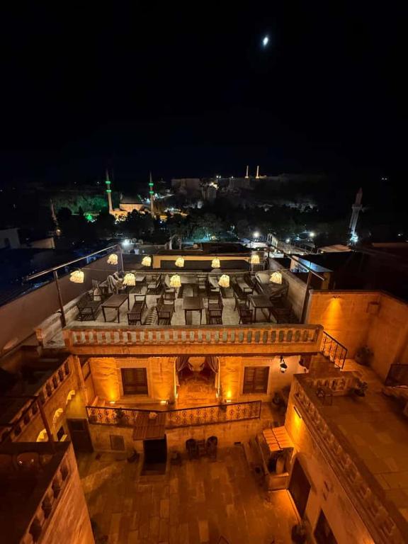 an aerial view of a building at night at Turkmen Konagi in Urfa