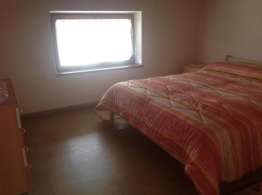 Łóżko lub łóżka w pokoju w obiekcie Palazzina Rosa