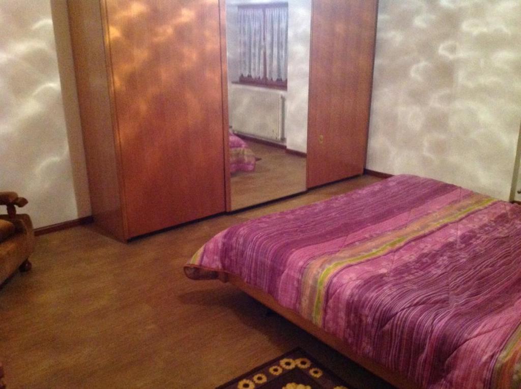 Łóżko lub łóżka w pokoju w obiekcie Palazzina Rosa