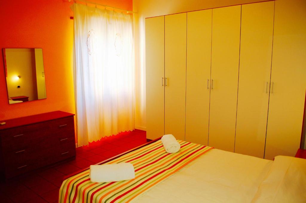 Postel nebo postele na pokoji v ubytování Orange Garden
