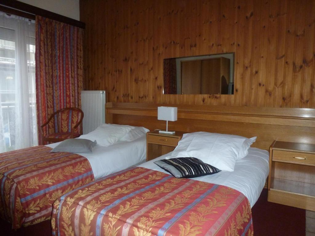 Postel nebo postele na pokoji v ubytování Hotel 'T Hert