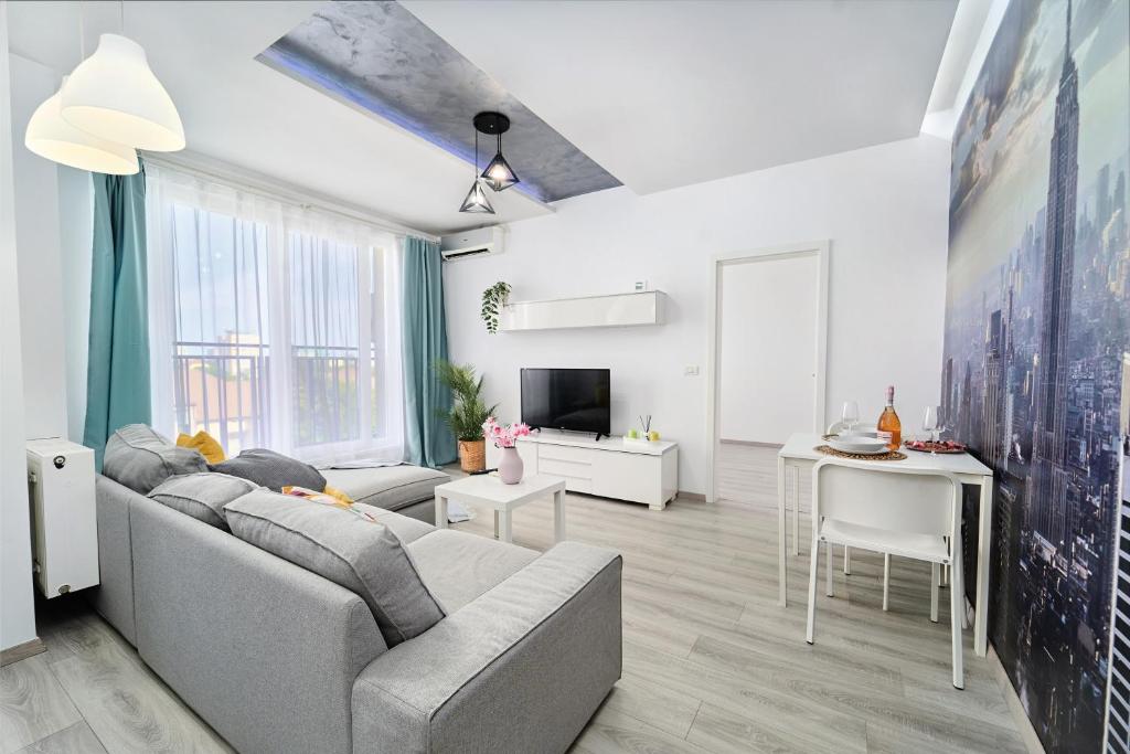 a living room with a couch and a table at Self check in 24h, Simple and Modern, 2 rooms, fast WiFi, parking, air conditioning, free cancelation, Traveller Award in Timişoara