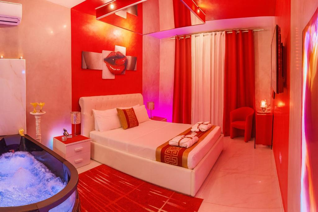 a bedroom with a bed and a tub in it at Bed Cinecitta’ in Rome